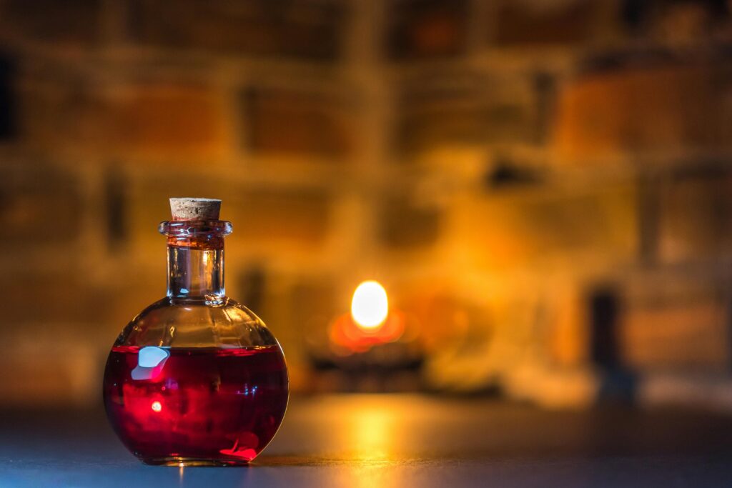 A mystical potion bottle glows warmly in candlelight against a rustic brick background.